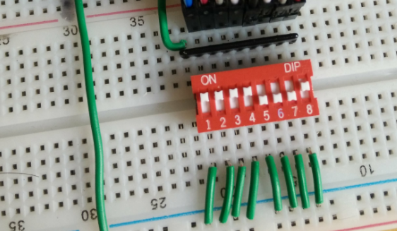 DIP switch across breadboard.