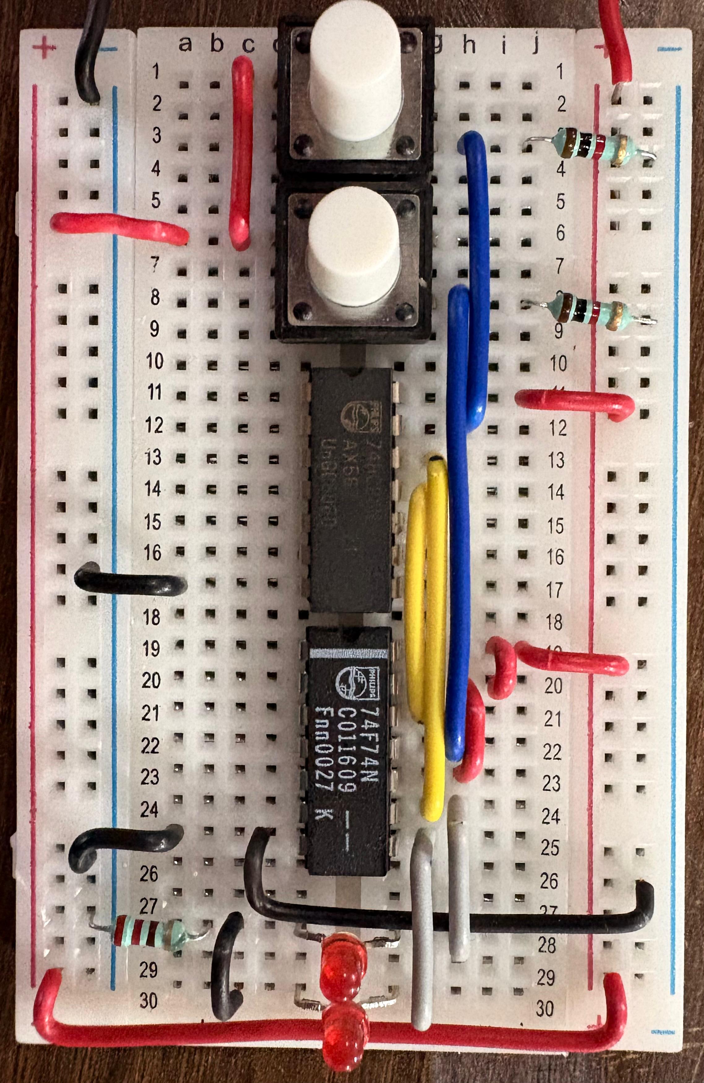 Breadboard schematic of T flip flop using D flip flop and XOR gate