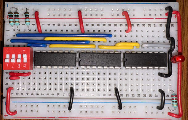 Complete breadboard implementation of a 2:1 Multiplexer using 74-series logic gates.